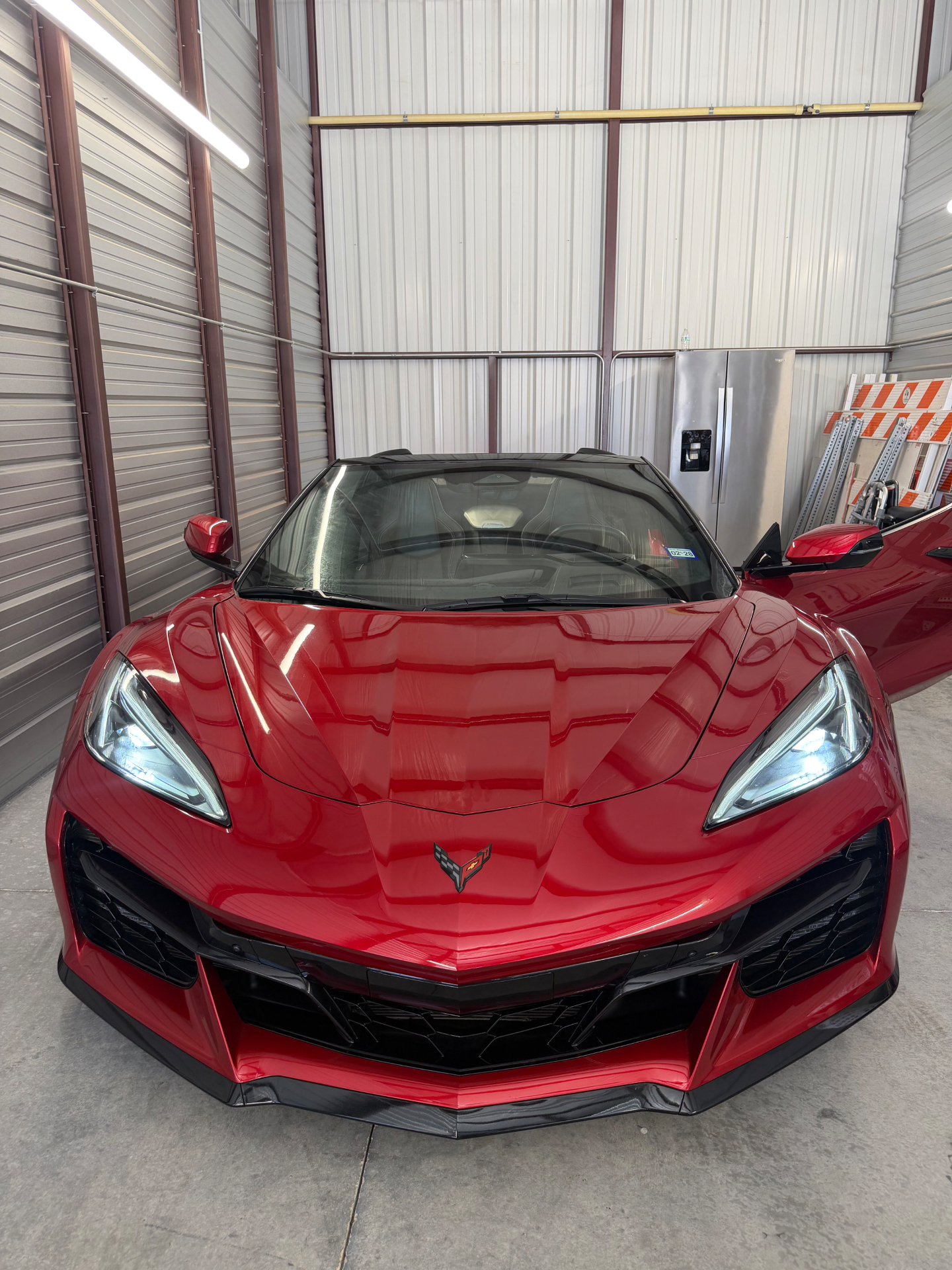 Red Mist Corvette Z06 convertible, front-on, low and wide